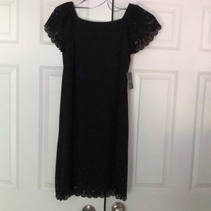 Sleek black off the shoulder dress with cutouts